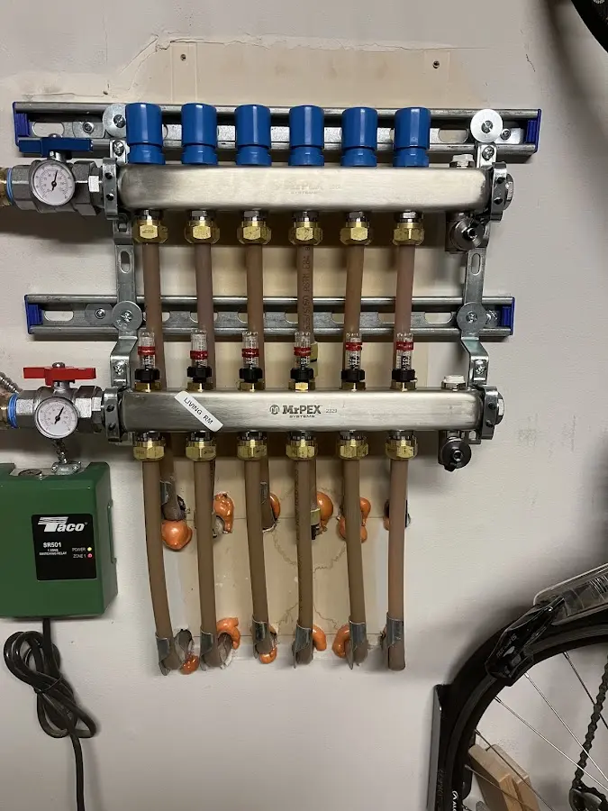 Plumber performing Water Heater Repair at a residential property in Veneta